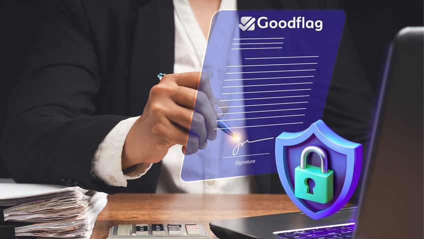 Une main signe un contrat de travail avec une signature électronique fournie par Goodflag, prestataire de services de confiance
